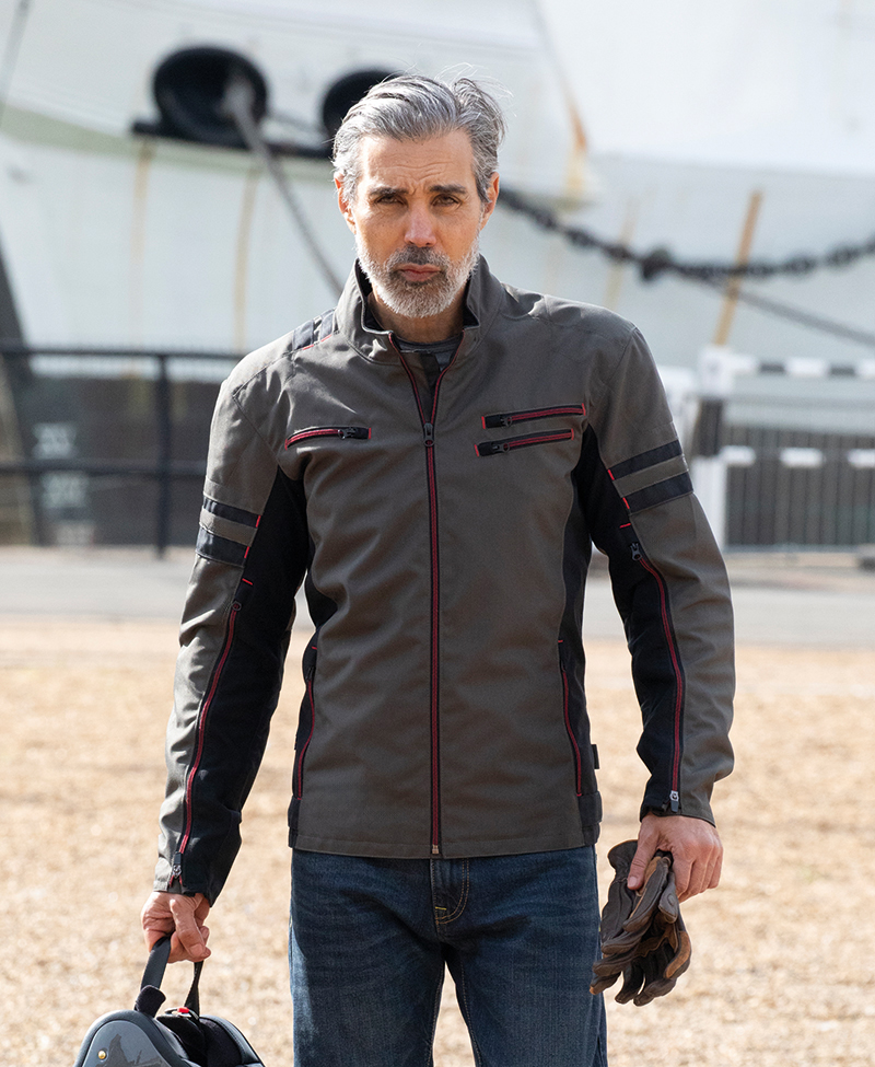 Guy wearing green Halvarssons Lysvik drop-liner jacket